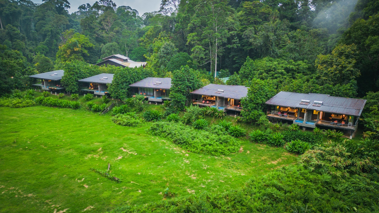 Borneo Rainforest Lodge chalets on the banks of the Danum River, surrounded by primary rainforest